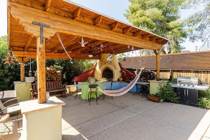 Hammock under ramada with fireplace