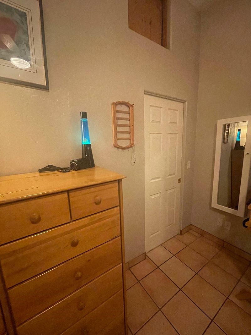 Large dresser with walk in closet to the right ( pocket door)