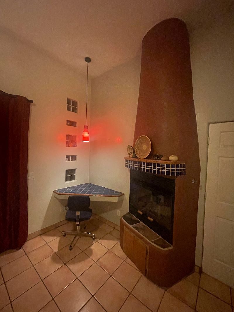corner desk with gas fireplace next to your work space