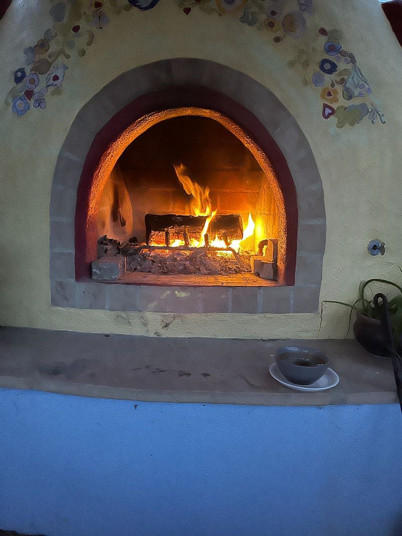 Gas starting wood fireplace under ramada