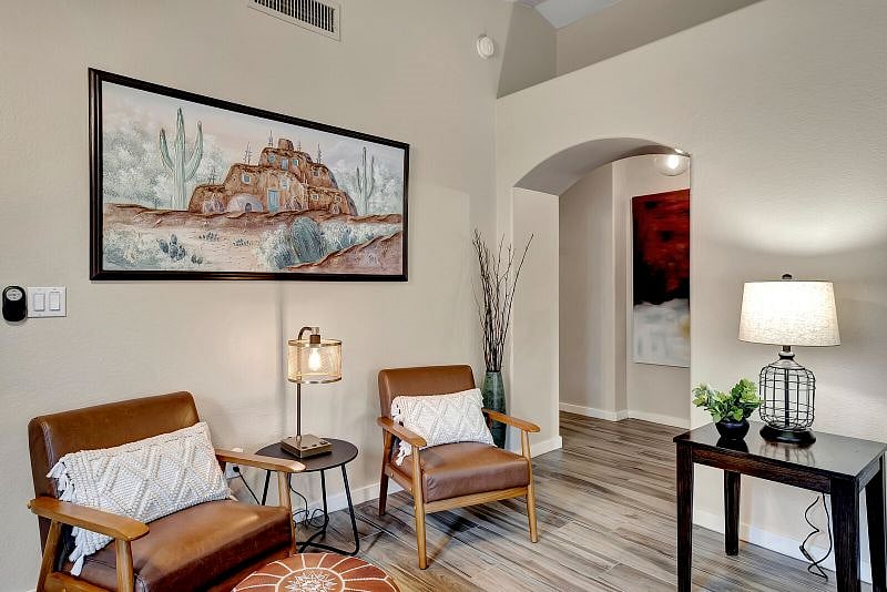 Bright and open living/dining room with 65" Smart TV with YouTube TV subscription.