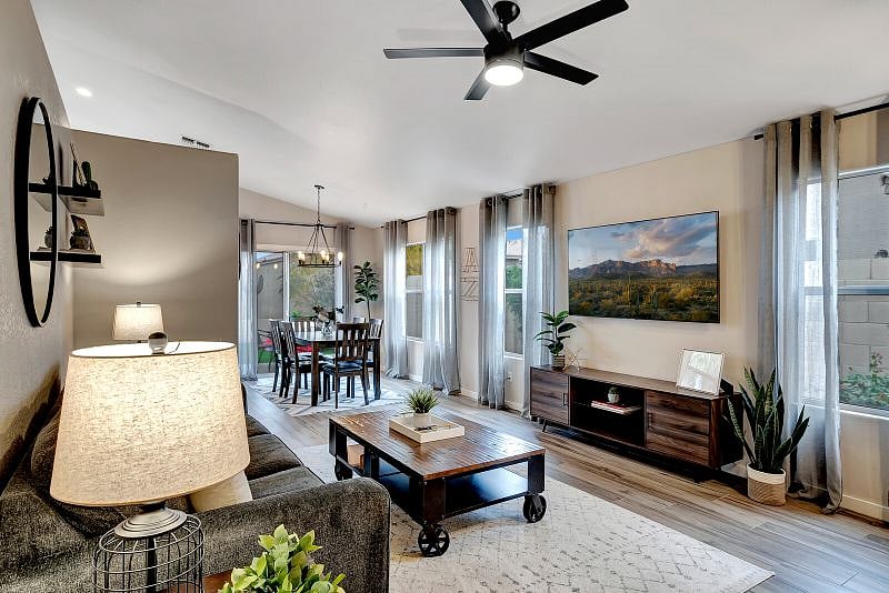 Bright and open living/dining room with 65" Smart TV with YouTube TV subscription.