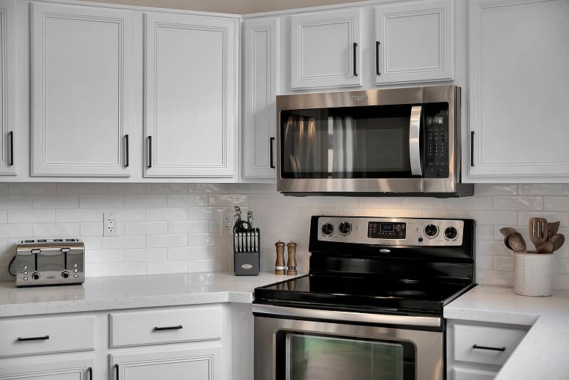 Trendy kitchen features white subway tile, Quartz countertops, Stainless Steel appliances and is fully-stocked for your stay.