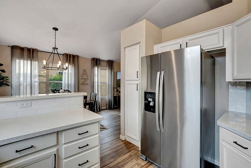 Trendy kitchen features white subway tile, Quartz countertops, Stainless Steel appliances and is fully-stocked for your stay.