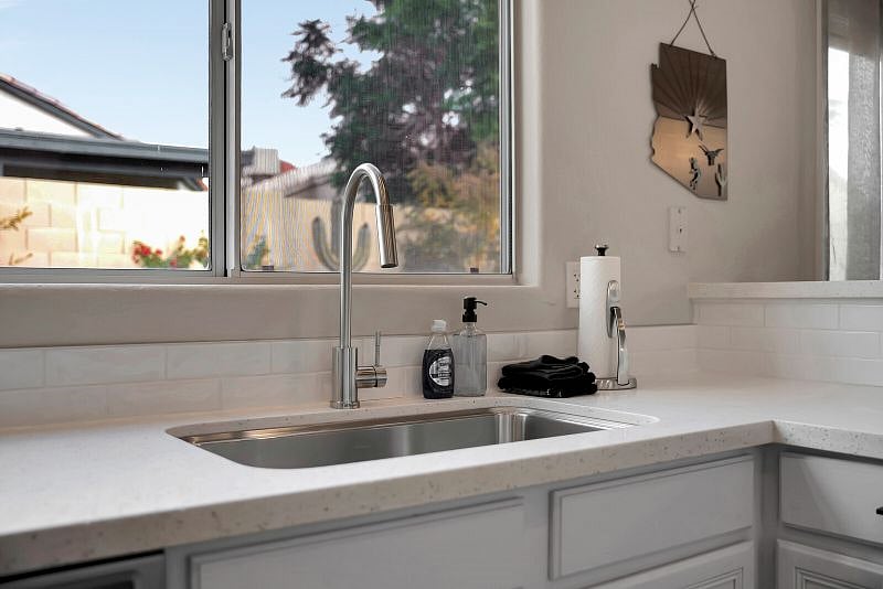 Trendy kitchen features white subway tile, Quartz countertops, Stainless Steel appliances and is fully-stocked for your stay.