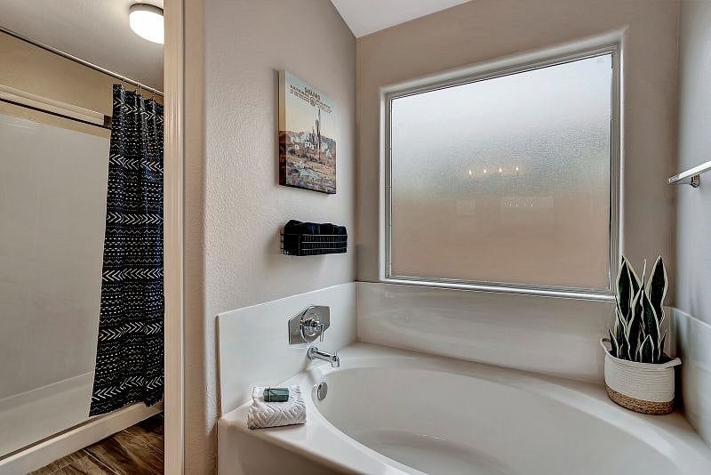 Ensuite off King Bedroom features double sinks, soaking tub, walk-in shower.