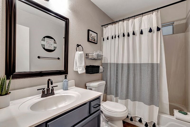 Hall Bathroom with Tub/Shower Combo and Matte black fixtures