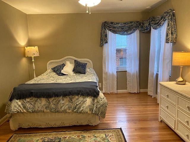 Light-filled bedroom looks out onto quiet rear entrance.
