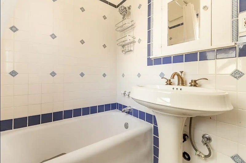Original tiled bathroom restored with generous sized cast iron tub