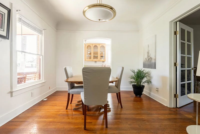 Dining room is between the kitchen and living room.
