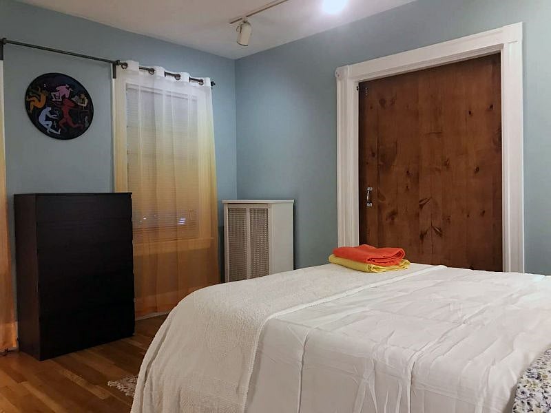 Master bedroom connected with a small bedroom by a sliding door