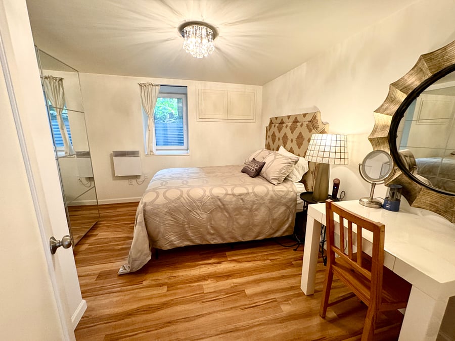 Bedroom 2 (Full-size bed): direction as coming in from door. European tilt windows that can be opened safely while sleeping, dimmer lighting.