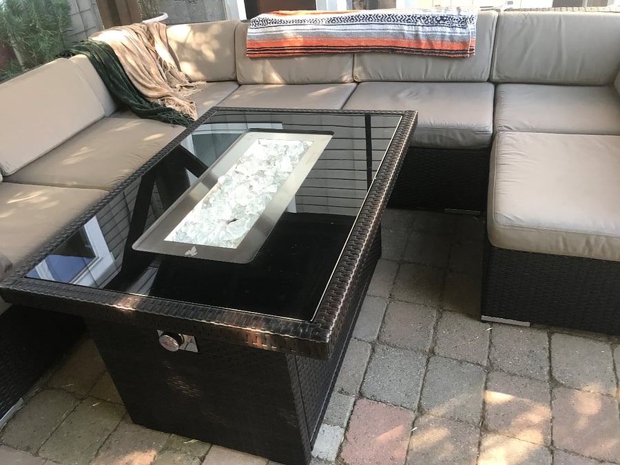 Covered and screened gazebo with gas fireplace in courtyard