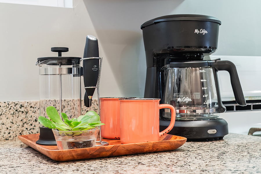 French press and Mr. Coffee and lots of coffee cups to choose from.