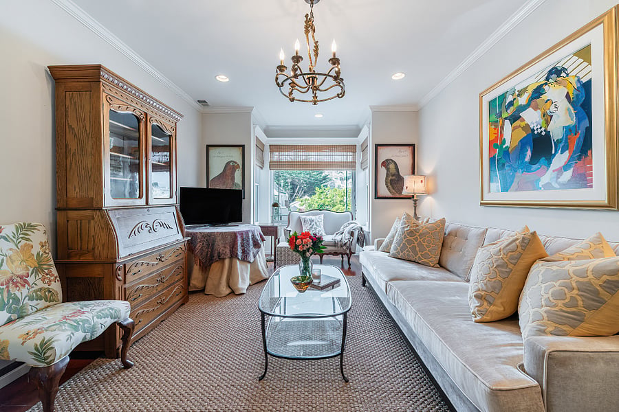 Enjoy the beautifully appointed living room with the extra wide and long comfortable couch, lots of choices for seating and lovely art work. Nice city view too!