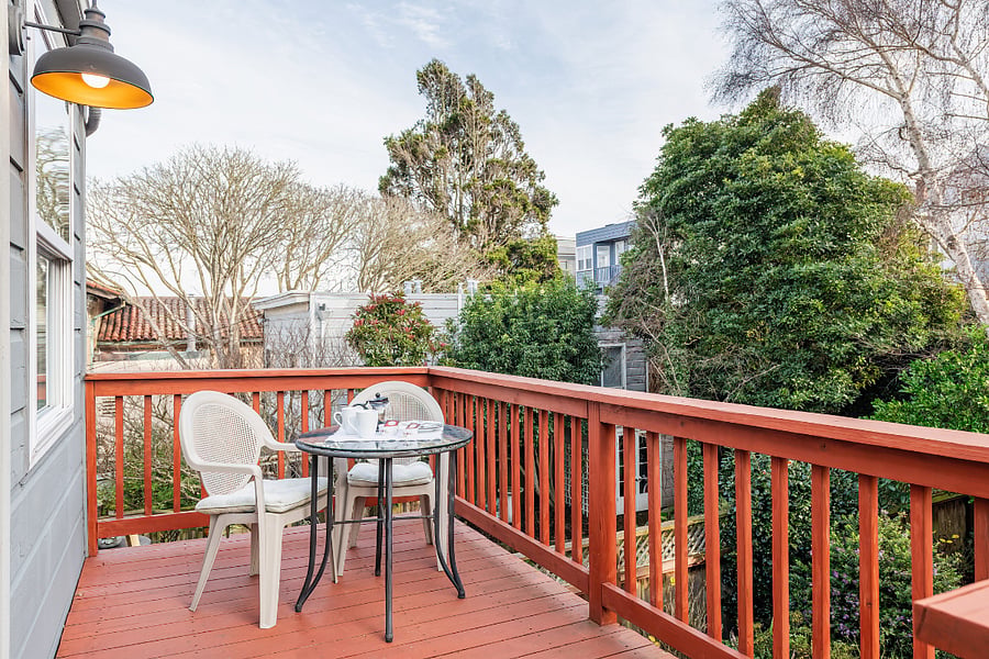 Private deck for upstairs at back of house. Enjoy the views and the peaceful neighborhood. Lots of trees!