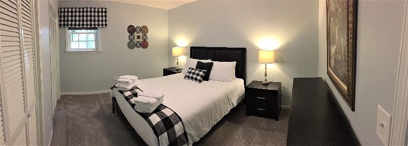 Vinyl wood look dark blinds behind the valance to dark out the room for day sleeping