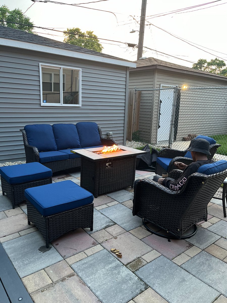Shared backyard patio area with fireplace.