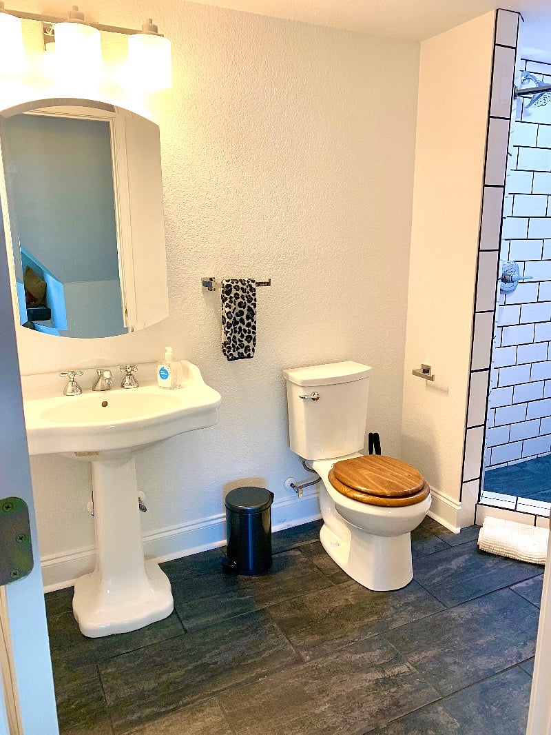 Clean bathroom with subway tile shower. 