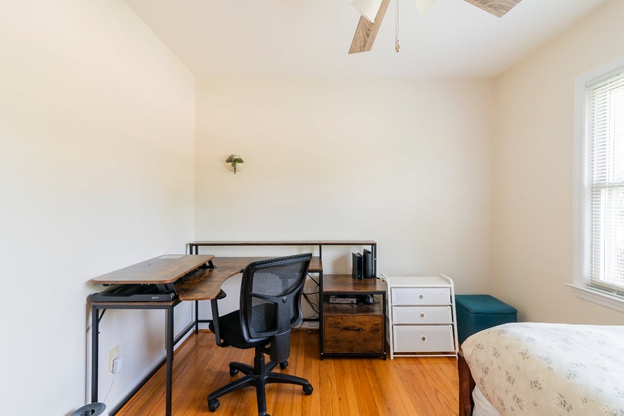 Twin bedroom with large desk