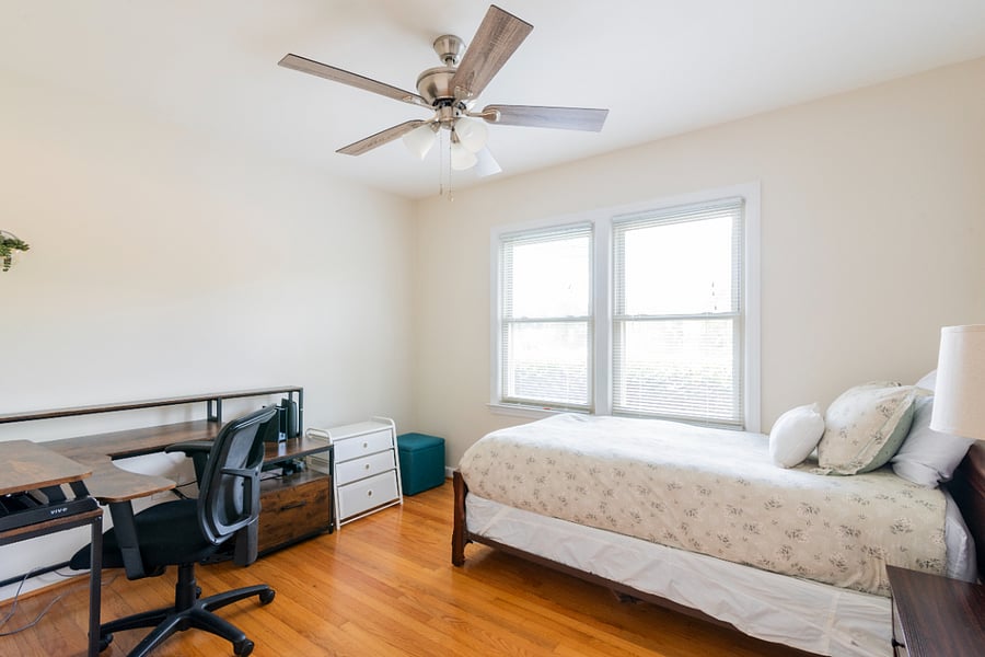 Twin bedroom with large desk