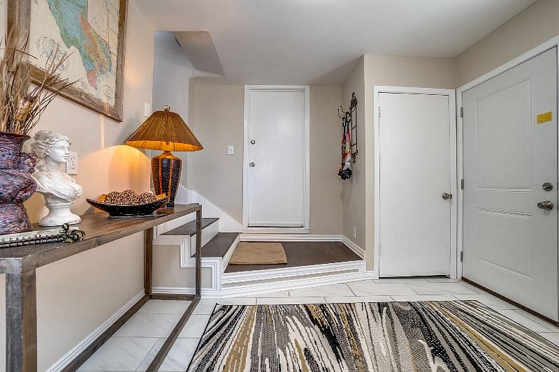 View here is of the mud room or laundry room that is the first floor of your apartment and where you'll enter. Many renters have used this room for placing keys on the lanai, and popping of their shoes