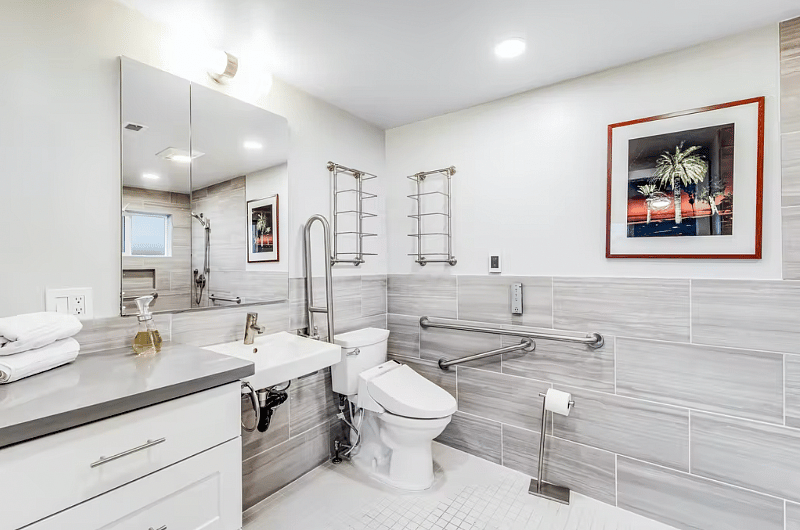 Marble and designer tile primary bath is ADA! And there's a bidet toilet!