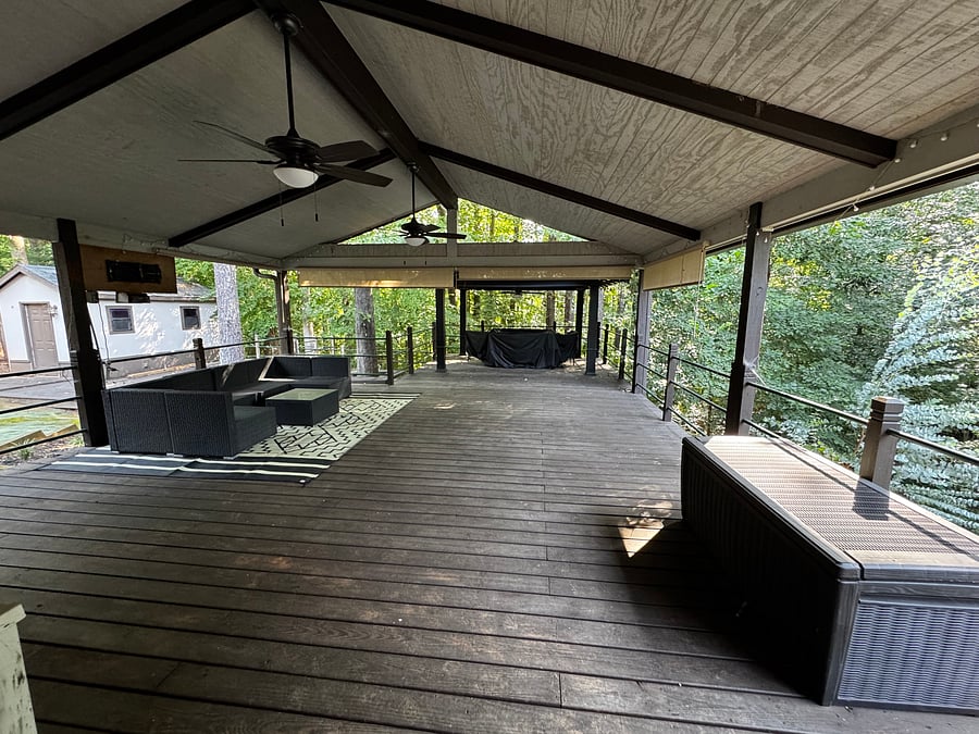 Outdoor couch sitting area and right seat dining table 