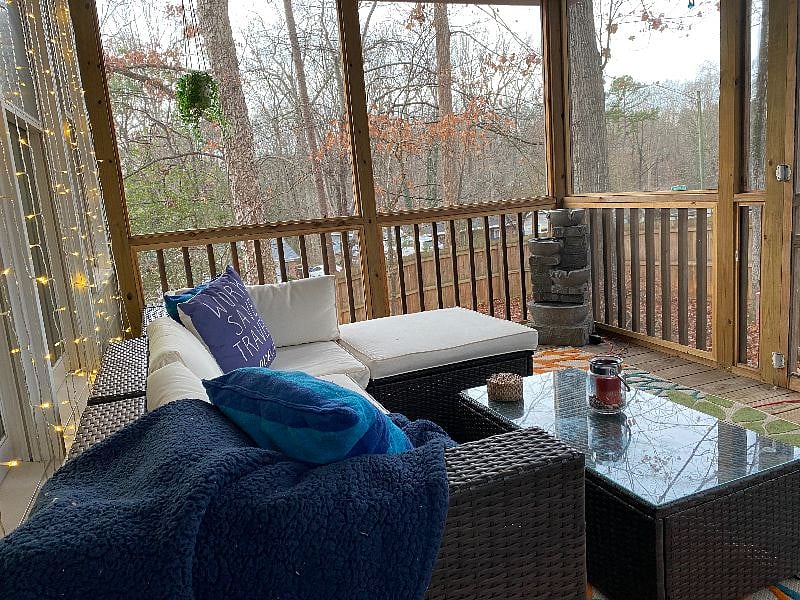 Relax on the screened porch. Has mini-fridge for storing beverages.