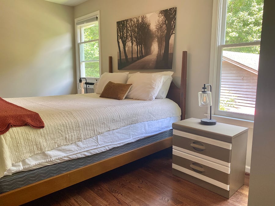 Comfy decor with blackout shades create a relaxing home away from home.