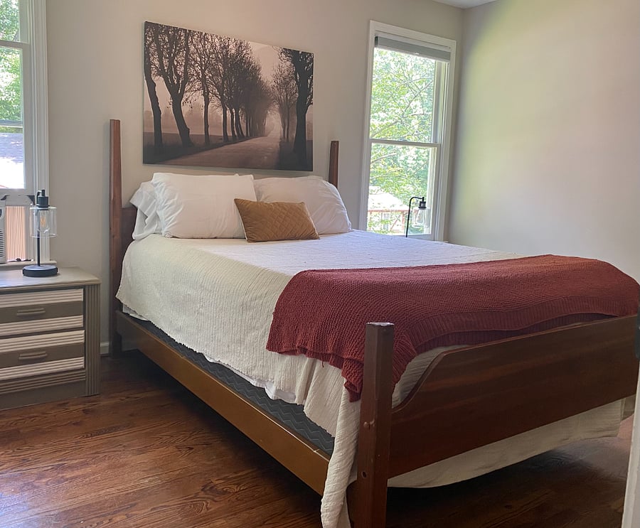 Queen sized bed with luxury linens.