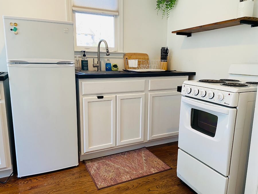 Perfectly-sized fridge, stove and oven. Shelf storage for extras. New countertops.