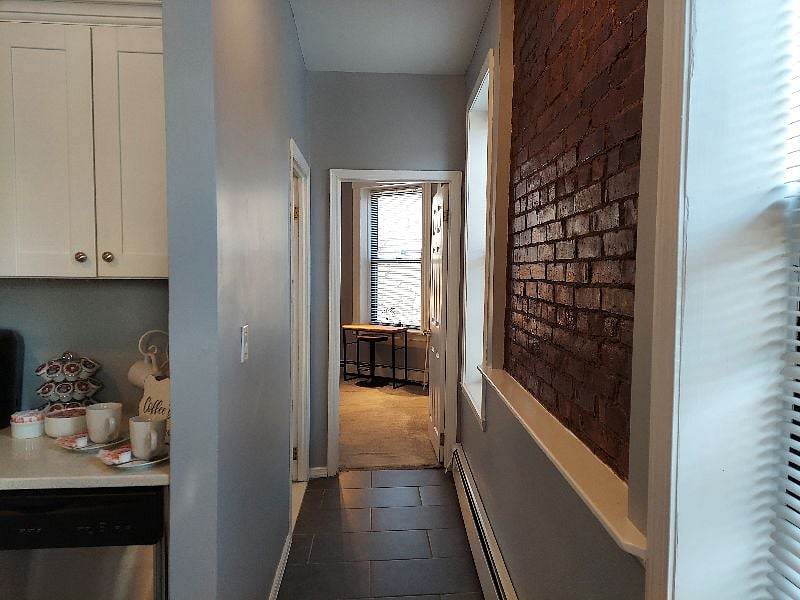 Hallway leading to bathroom and second bedroom