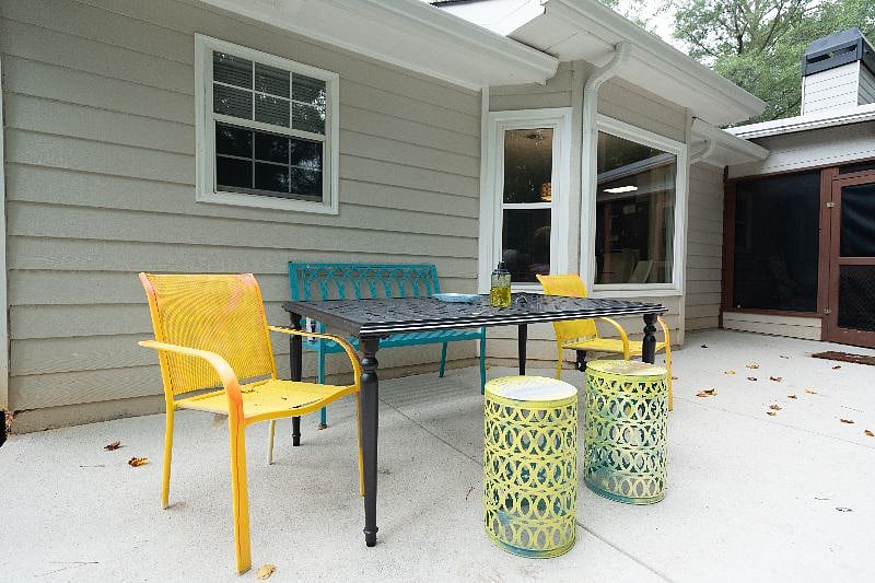 Outdoor living space look out to a serene private forest.