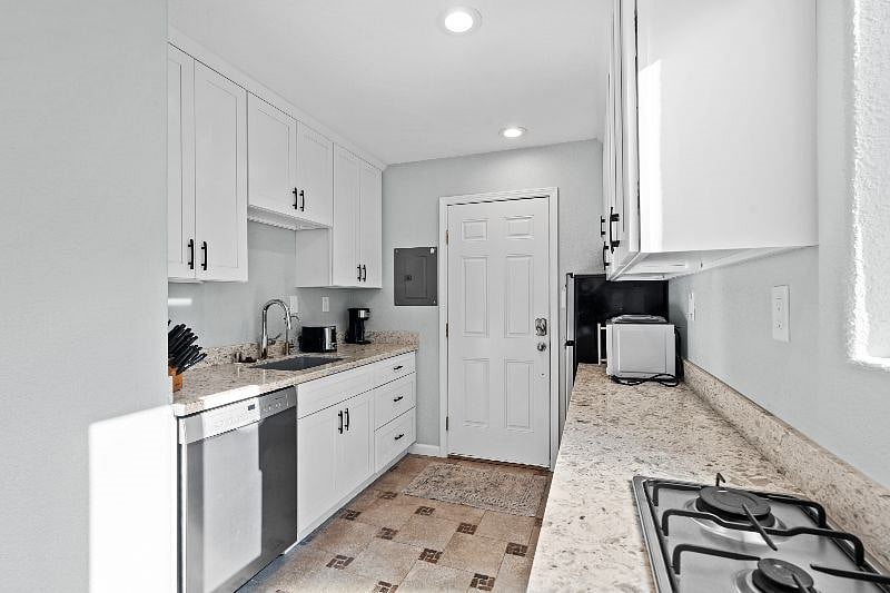 Kitchen includes all dishes, glassware, and utensils with abundant storage space.