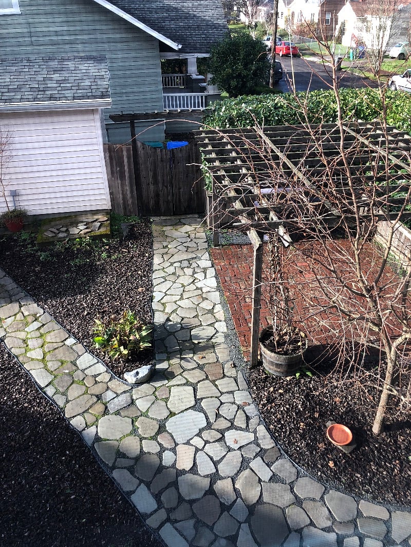View down into yard from upstairs landing