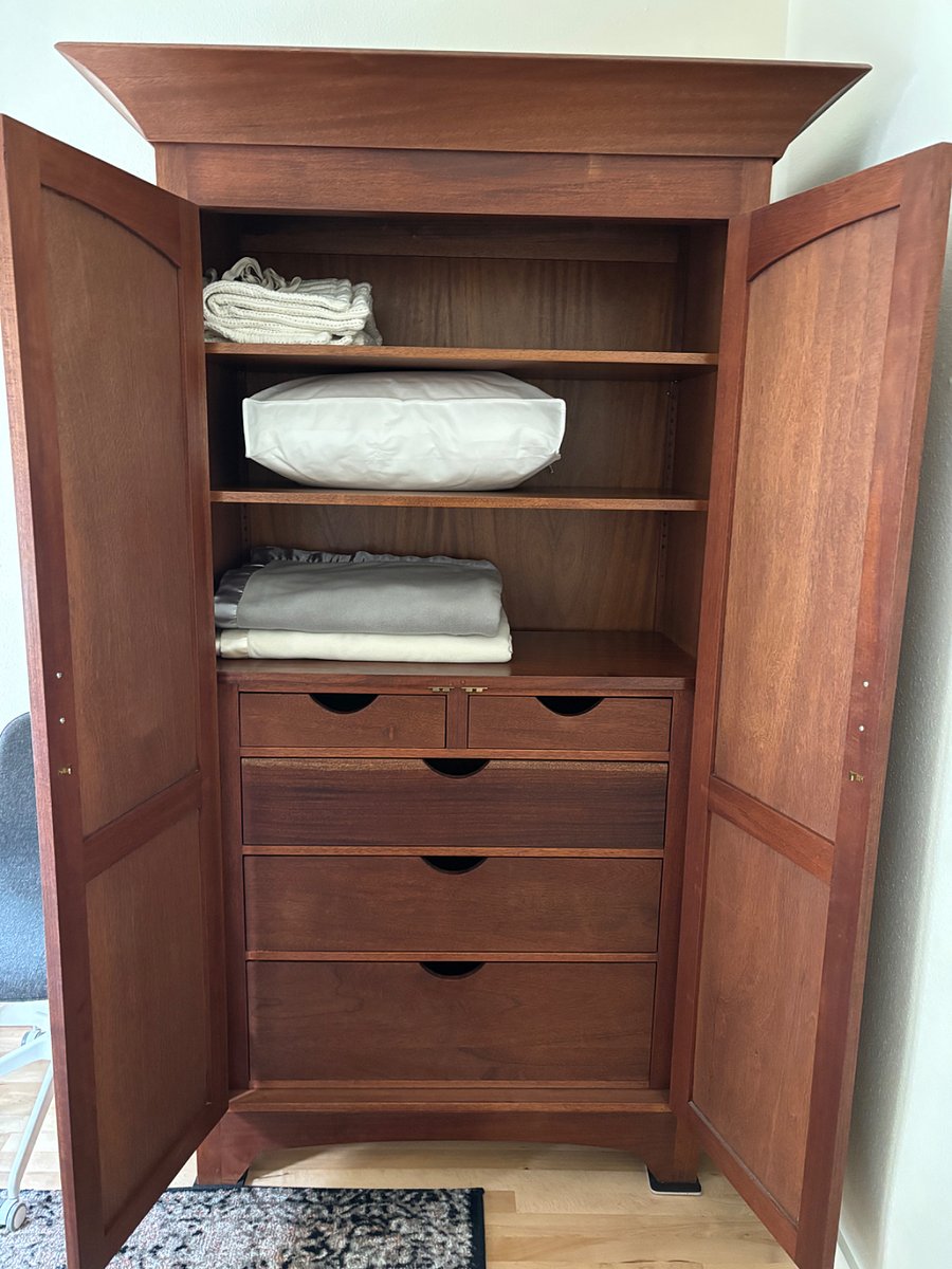 Solid hand made mahogany armoire for your clothes, bedding, storage in addition to the small closet in the bedroom.