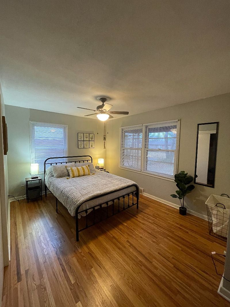 Master bedroom with queen bed and desk office space