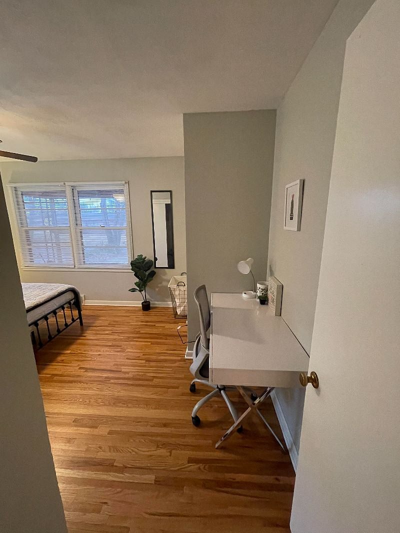 Master bedroom with queen bed and desk office space