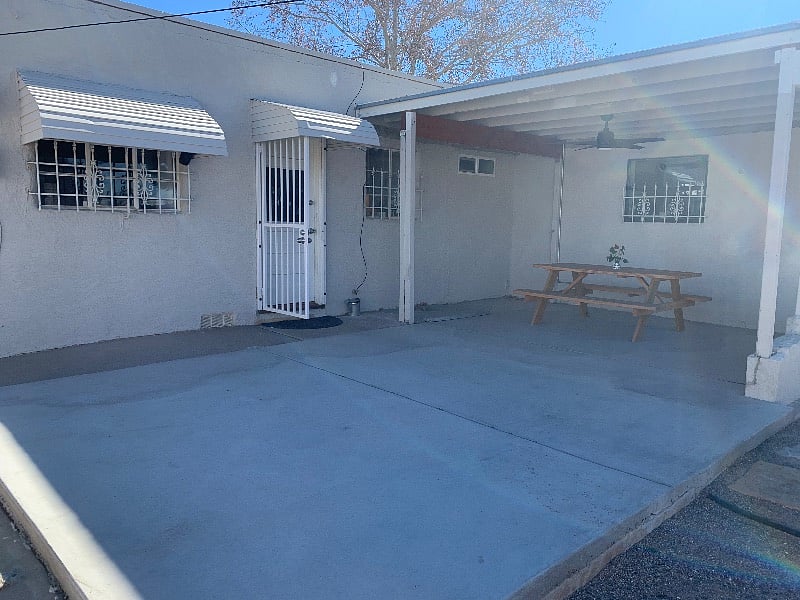 Large porch with fan to keep you cool during the summer with hammock anchors installed to make yourself extra comfortable