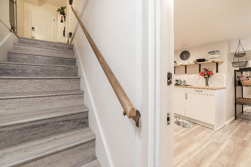 The apartment door opens to the kitchen