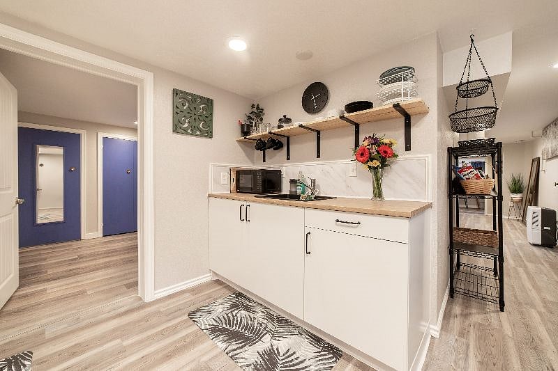 Bright and airy. 10x10 kitchen with supplies and space to cook. Garbage disposal and microwave.