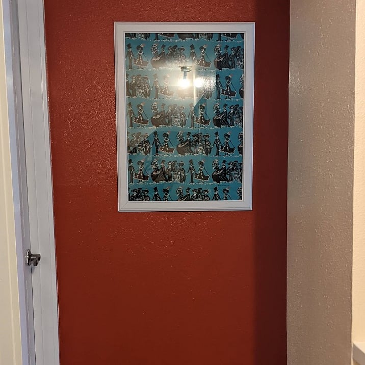 This is the best I can do to show the upstairs hallway- it is short. The upstairs of the home is your bedroom, my bedroom, and the 3/4 bathroom that I use. Your room is to the right of the artwork, my room is to the left.