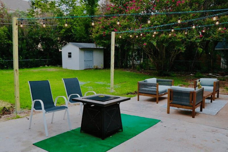 Relax under the backyard string lights! Backyard features a propane BBQ grill, propane fire table, a family seating area. S'mores anyone?