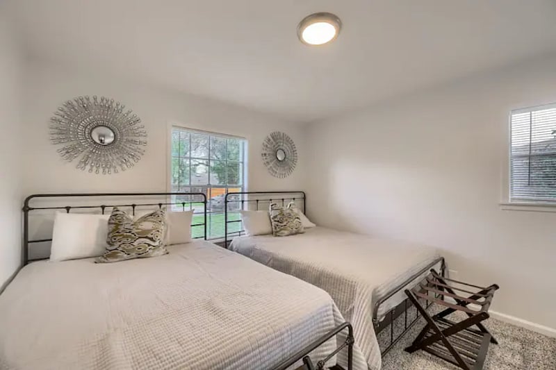 Two queen beds with luggage racks