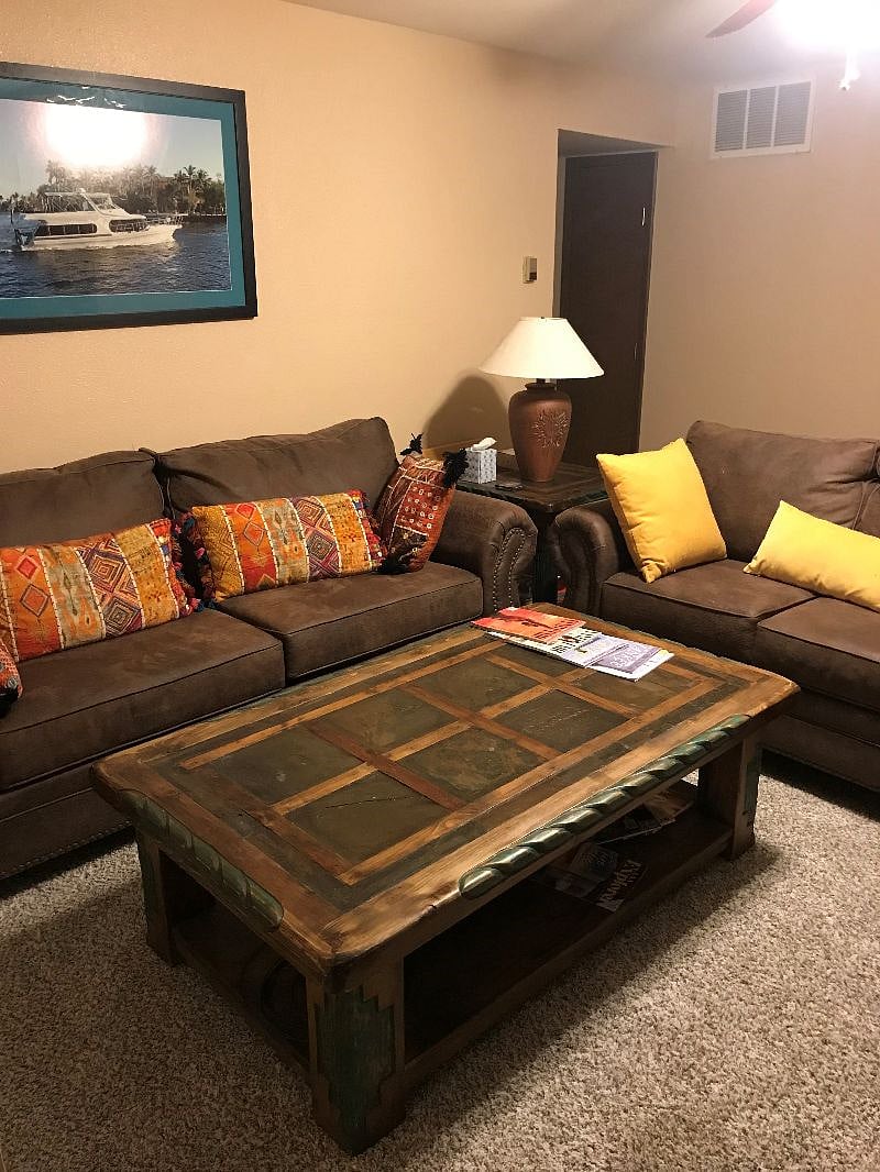 Living room seating area with coffee table.
