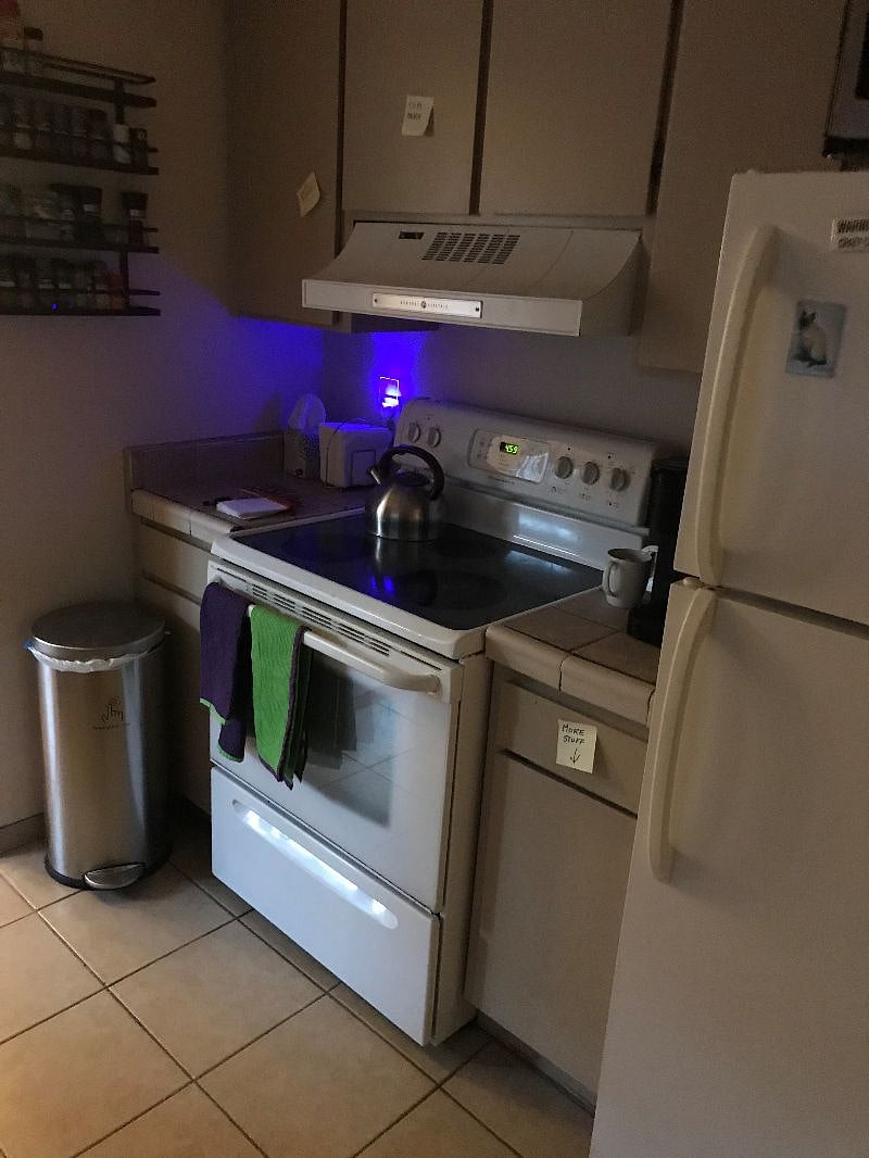 Kitchen looking at stove with frig to the right.