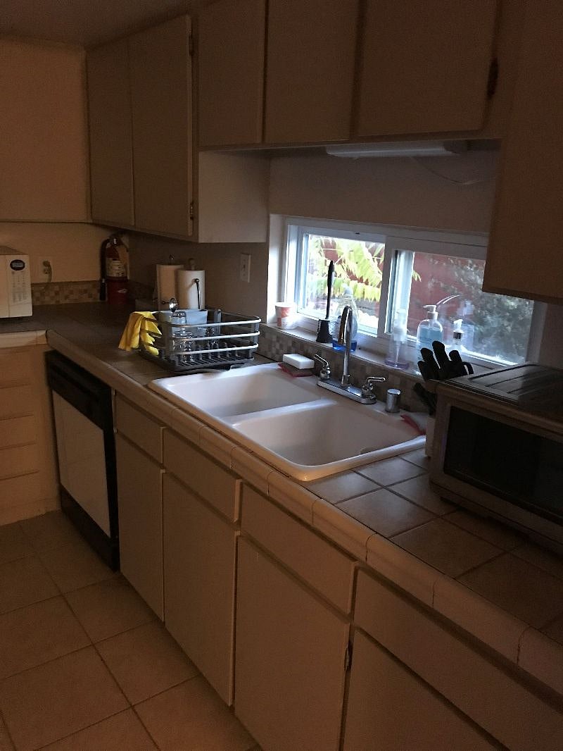 Additional view of kitchen showing sink and dishwasher