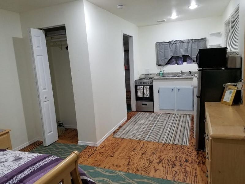 View of closet and kitchenette from bed and front door.