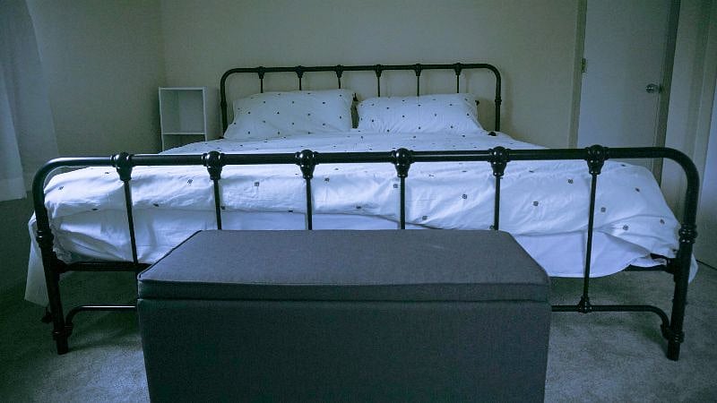 King-sized bed in downstairs bedroom.